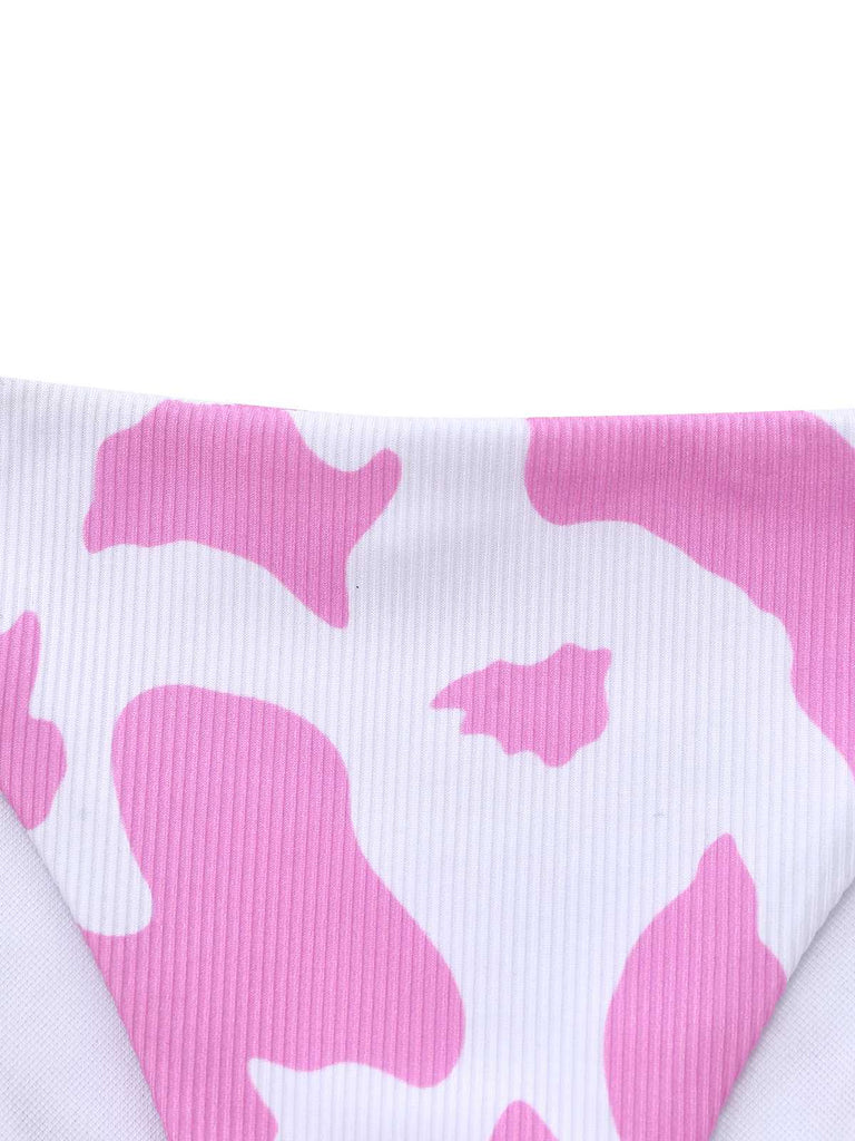 Close-up of the ribbed pink and white cow print fabric.