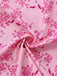 Macro view of the smooth fabric texture featuring a detailed pink floral design.