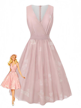A sleeveless pink A-line dress with a subtle floral pattern, featuring a deep V-neckline and a cinched waist.