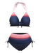 A two-piece bikini set featuring a pink-to-navy blue ombre gradient, including a halter-neck top with ruffled trim and high-waisted bottoms with side-tie details.
