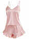 Side view of the pink satin sleepwear set showing the lightweight drape and comfortable fit of the cami and shorts.