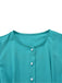 Close-up of the simple round neckline and the top white pearl buttons on the teal fabric.