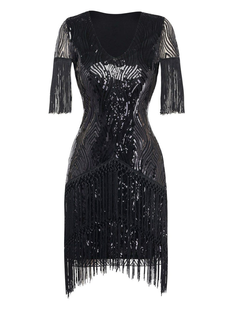 Front view of the black sequin cocktail dress with fringe detailing on the sleeves and skirt.