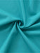 A swirled close-up of the teal fabric showing a fine crepe-like texture and rich color saturation.