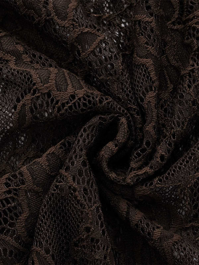 Macro view of the intricate floral lace pattern over the dark brown base fabric.