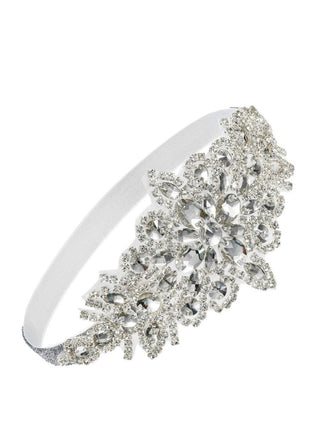 Silver headband with floral crystal design on a white background
