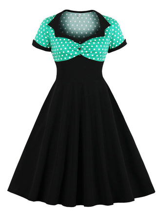 She slips into this 1950s Polka Dot Patchwork Swing Dress and suddenly it's a 1950s daydream