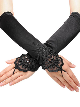 She adds this Black 1920s Fingerless Lace Gloves and suddenly it's 1920s perfection