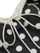 Close-up: 1950s Black 1950s Polka Dots Halter Swimsuit, perfect for vintage themed parties and retro fashion enthusiasts